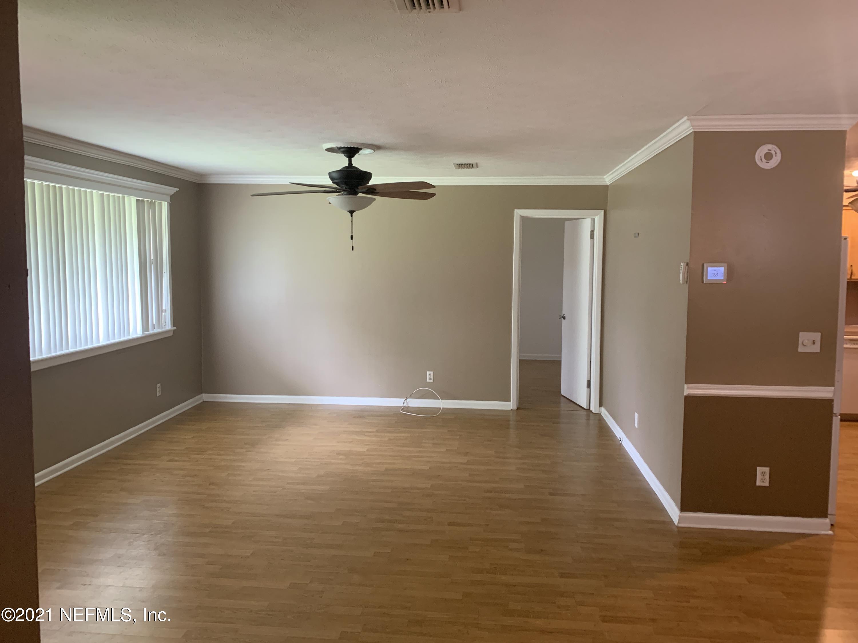 4126 Dayrl Road Jacksonville, FL 32207 - Photo 4 of 26 a view of an empty room with a window