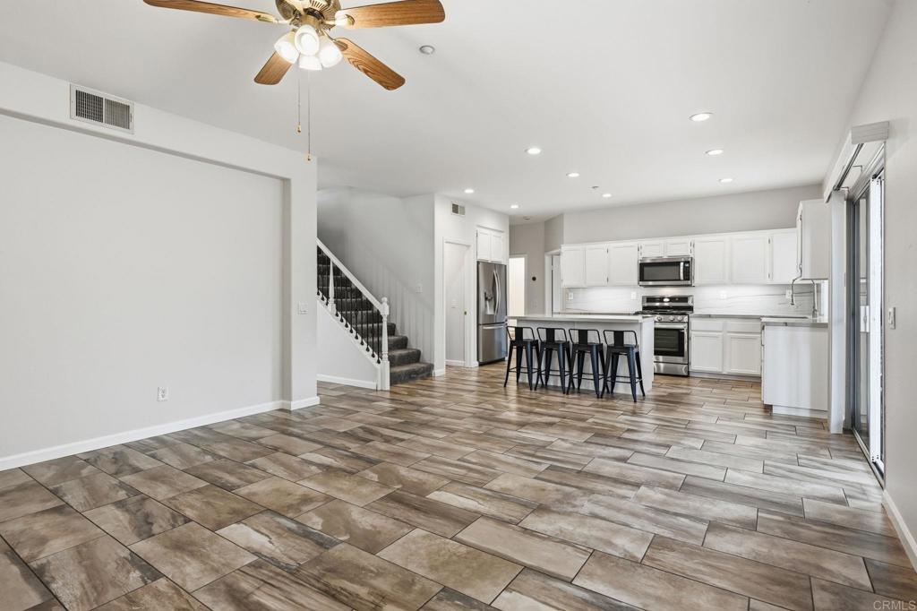 5051 Lake Circle Road Fallbrook, CA 92028 - Photo 13 of 57 a view of kitchen and dining room with wooden floor