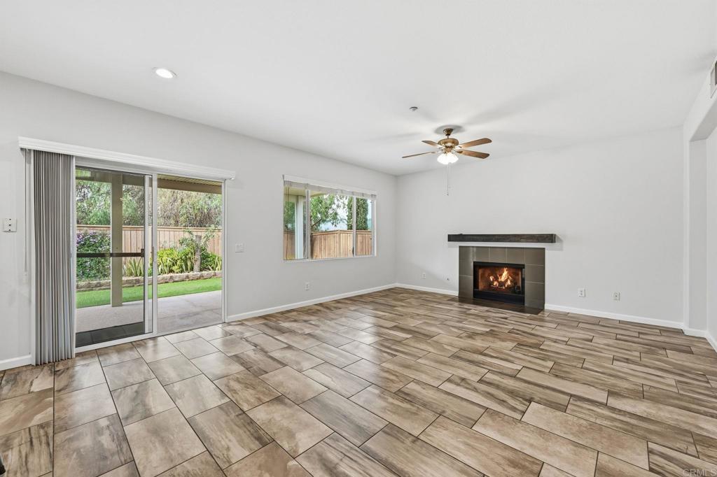 5051 Lake Circle Road Fallbrook, CA 92028 - Photo 15 of 57 a view of an empty room with a fireplace and a window