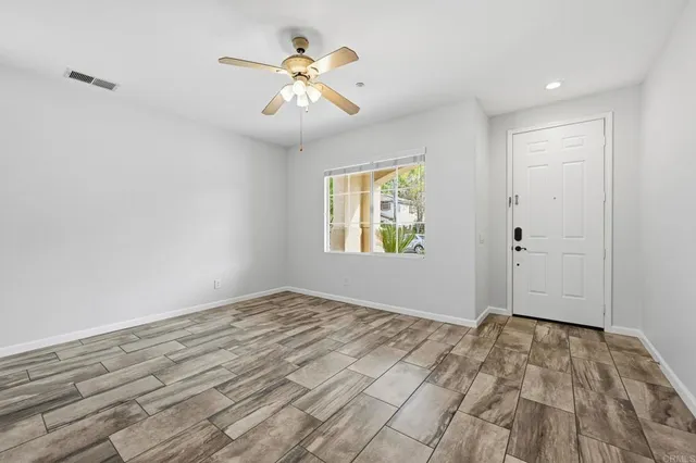 a view of an empty room with windows