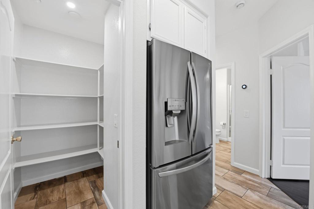 5051 Lake Circle Road Fallbrook, CA 92028 - Photo 14 of 50 a metallic refrigerator freezer sitting in a kitchen