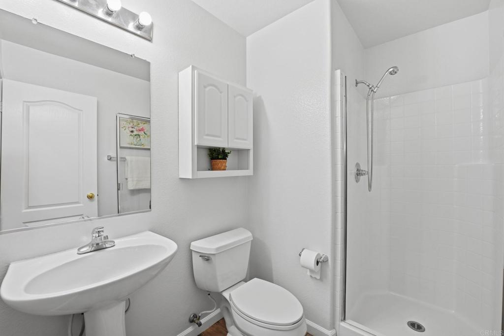 5051 Lake Circle Road Fallbrook, CA 92028 - Photo 15 of 50 a bathroom with a sink toilet and shower
