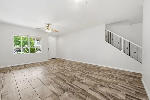 a view of a workspace with furniture window and wooden floor