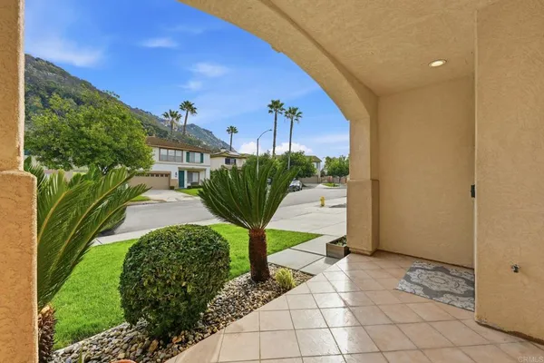 a view of two chairs in a patio