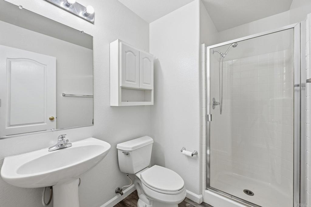 5051 Lake Circle Road Fallbrook, CA 92028 - Photo 23 of 57 a bathroom with a sink toilet and shower