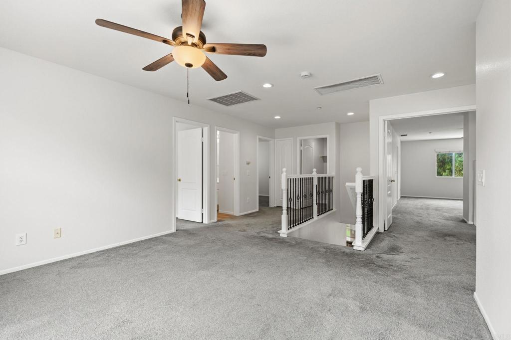 5051 Lake Circle Road Fallbrook, CA 92028 - Photo 25 of 57 a view of empty room with wooden floor and ceiling fan