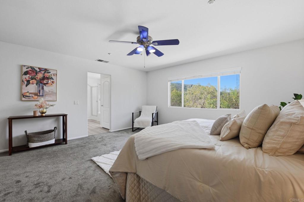 5051 Lake Circle Road Fallbrook, CA 92028 - Photo 27 of 50 a bedroom with a bed and a window
