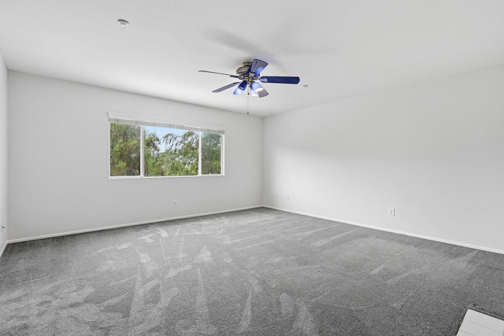 5051 Lake Circle Road Fallbrook, CA 92028 - Photo 31 of 57 an empty room with windows and fan