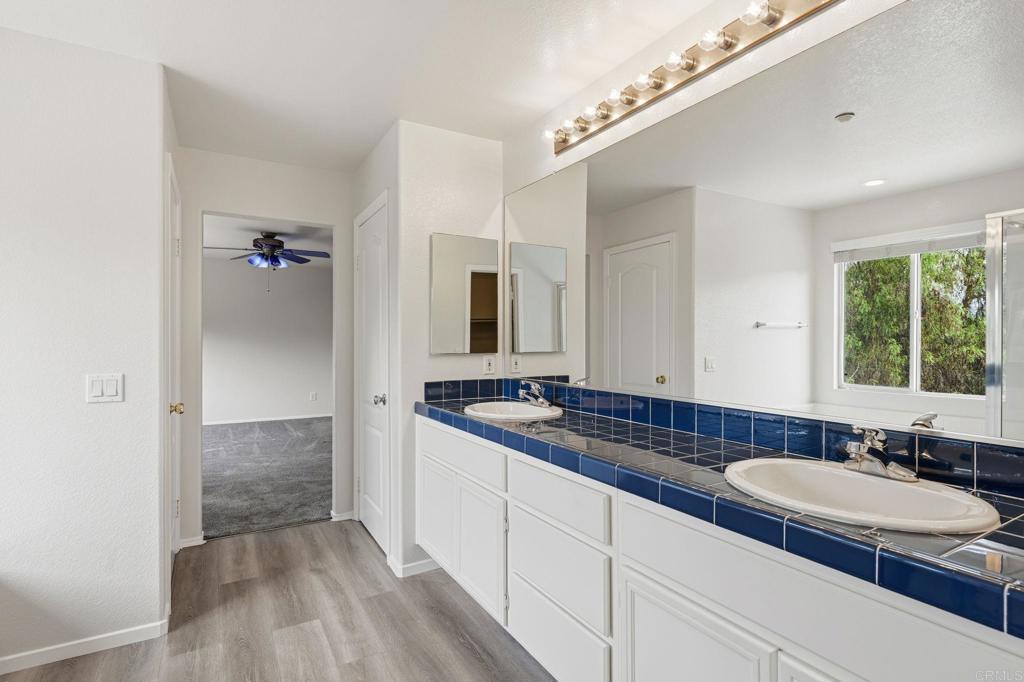5051 Lake Circle Road Fallbrook, CA 92028 - Photo 38 of 57 a bathroom with a sink and a mirror