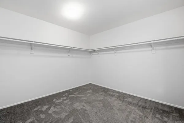 a view of an empty walk in closet