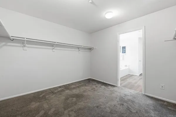 a white bath tub sitting next to a window