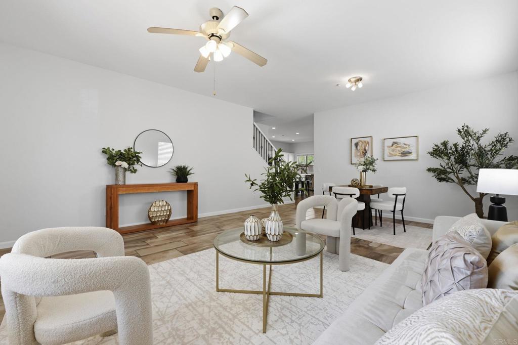 5051 Lake Circle Road Fallbrook, CA 92028 - Photo 49 of 50 a living room with furniture a chandelier and a potted plant