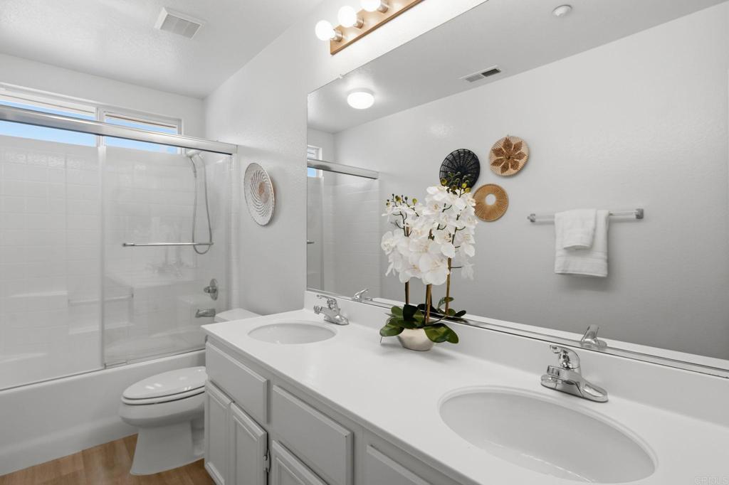 5051 Lake Circle Road Fallbrook, CA 92028 - Photo 39 of 50 a bathroom with a sink toilet and shower