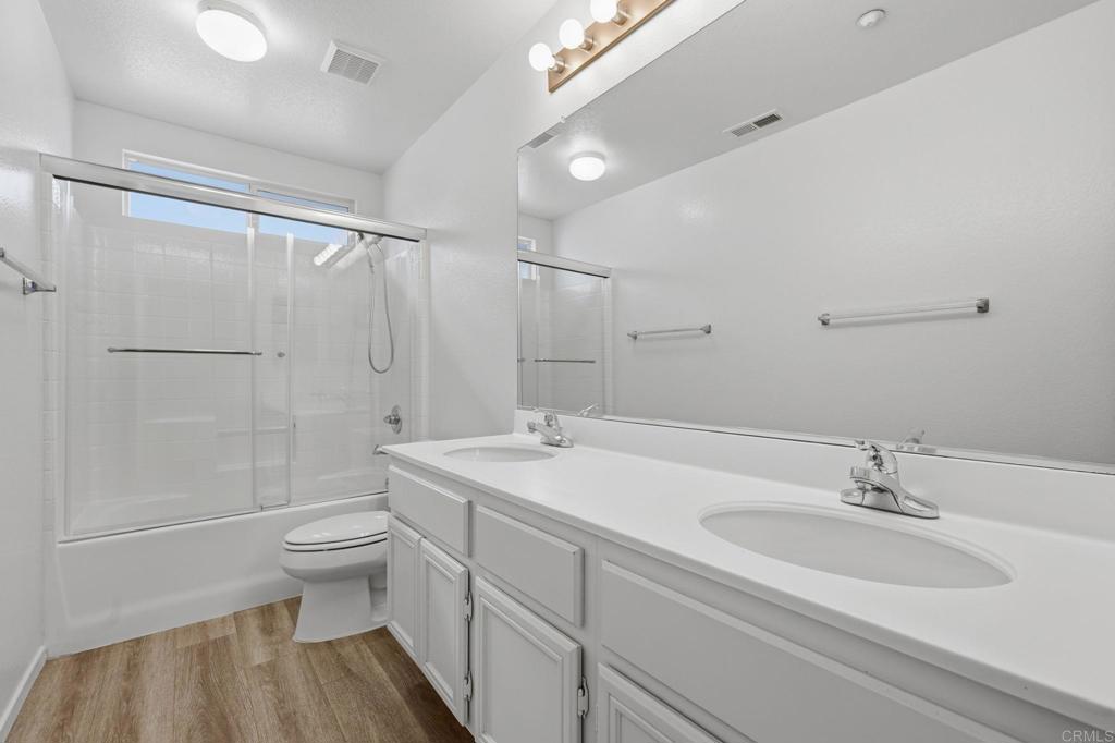 5051 Lake Circle Road Fallbrook, CA 92028 - Photo 43 of 57 a bathroom with a sink a toilet and shower