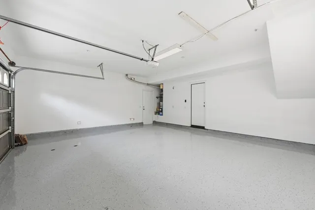 a view of a backyard with plants and a patio