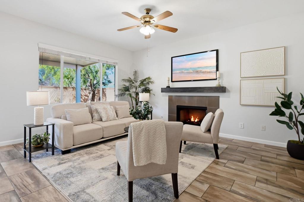 5051 Lake Circle Road Fallbrook, CA 92028 - Photo 5 of 50 a living room with furniture a table and a fireplace