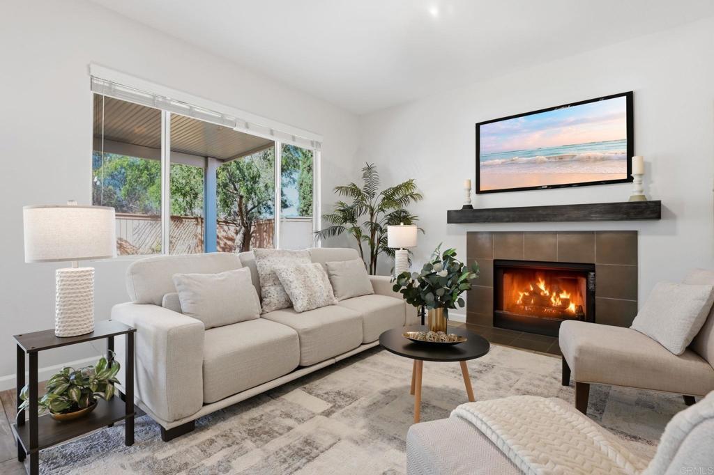 5051 Lake Circle Road Fallbrook, CA 92028 - Photo 6 of 50 a living room with furniture a fireplace and a large window
