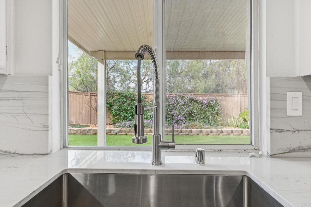 5051 Lake Circle Road Fallbrook, CA 92028 - Photo 10 of 57 a kitchen with a sink and a large window