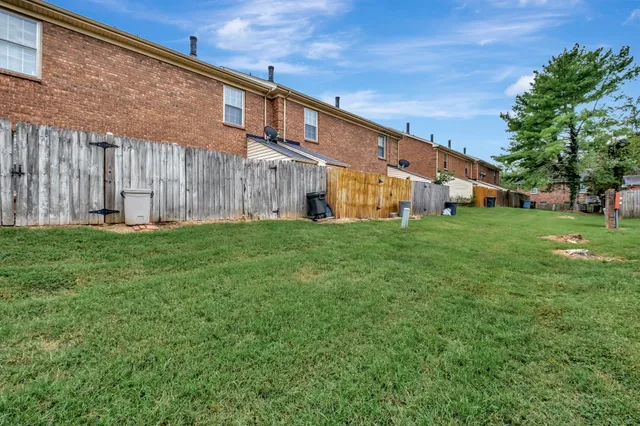 a big yard with large trees