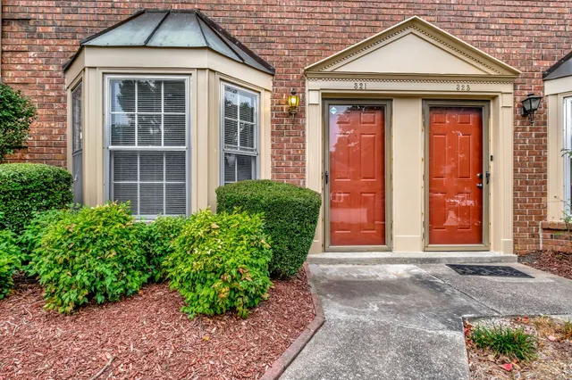a front view of a house with garden