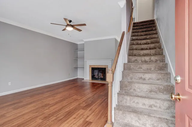 wooden floor in an empty room with a fireplace