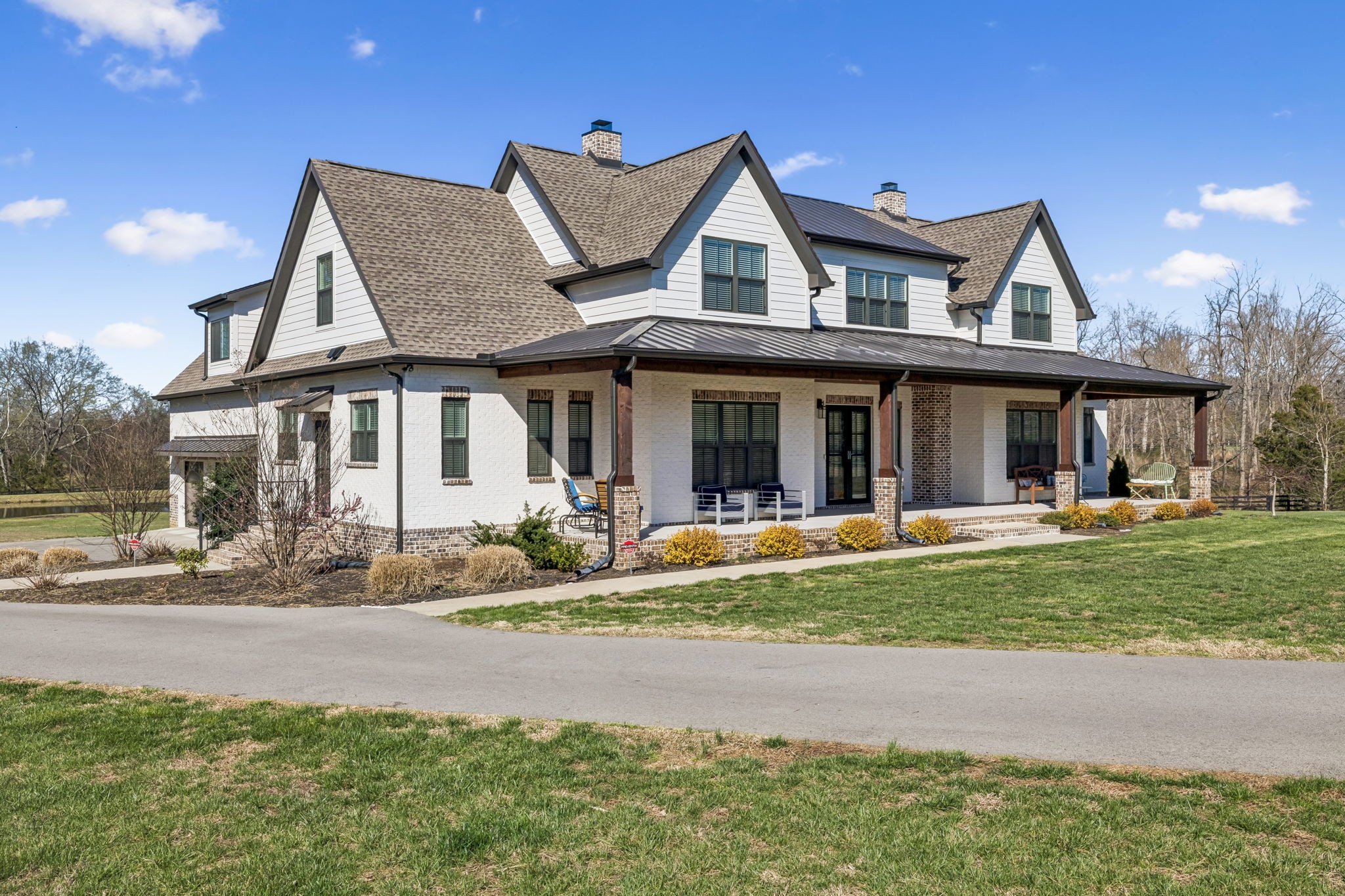 4900 Charles Dorris Road Springfield, TN 37172 - Photo 1 of 39 a front view of a house with garden and porch