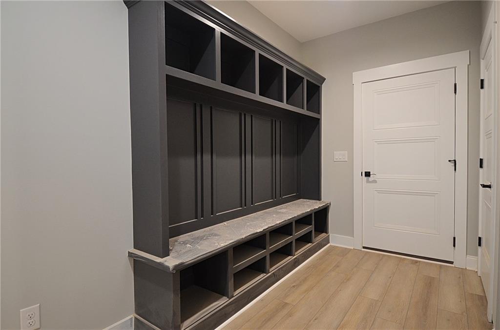 1216 Rays River Run Bogart, GA 30622 - Photo 12 of 25 a view of an empty room with wooden floor and cabinet