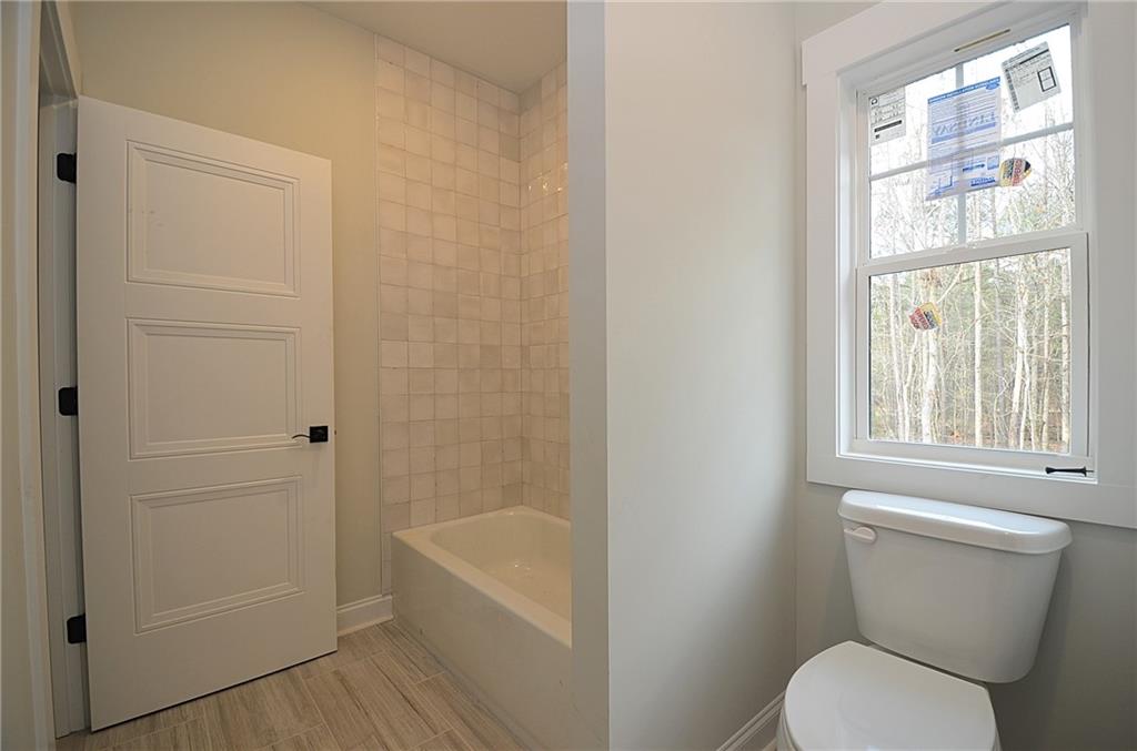 1216 Rays River Run Bogart, GA 30622 - Photo 18 of 25 a white toilet sitting next to a bath tub