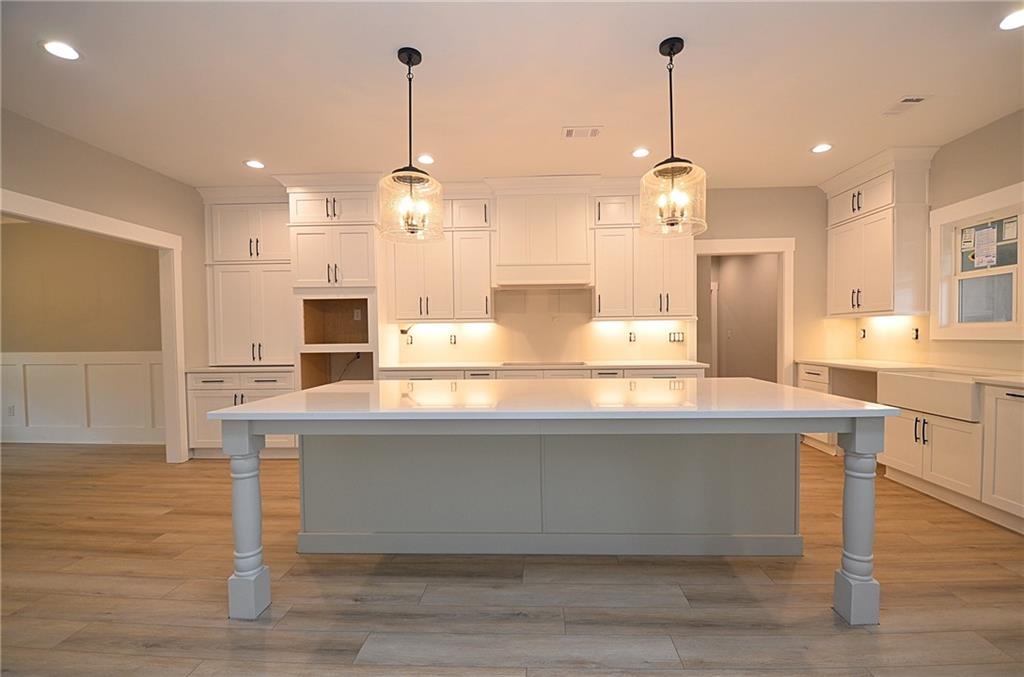 1216 Rays River Run Bogart, GA 30622 - Photo 6 of 25 a view of a kitchen with kitchen island stainless steel appliances a sink and a living room view