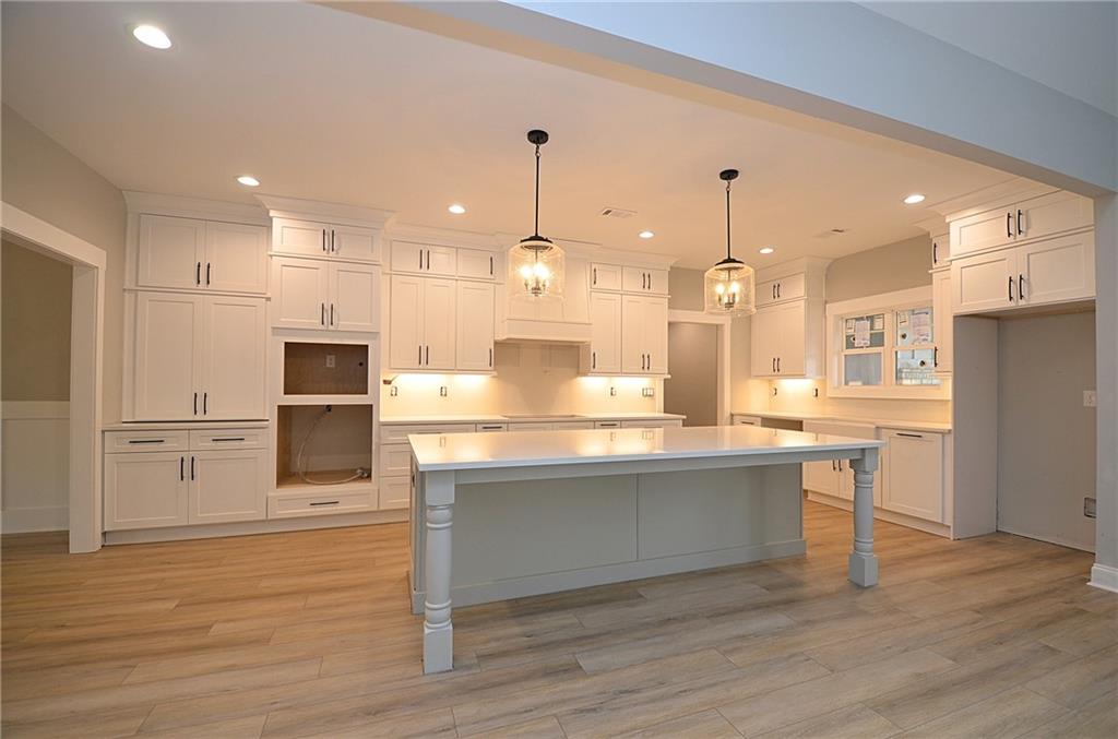 1216 Rays River Run Bogart, GA 30622 - Photo 7 of 25 a kitchen with stainless steel appliances granite countertop a sink a stove and a refrigerator