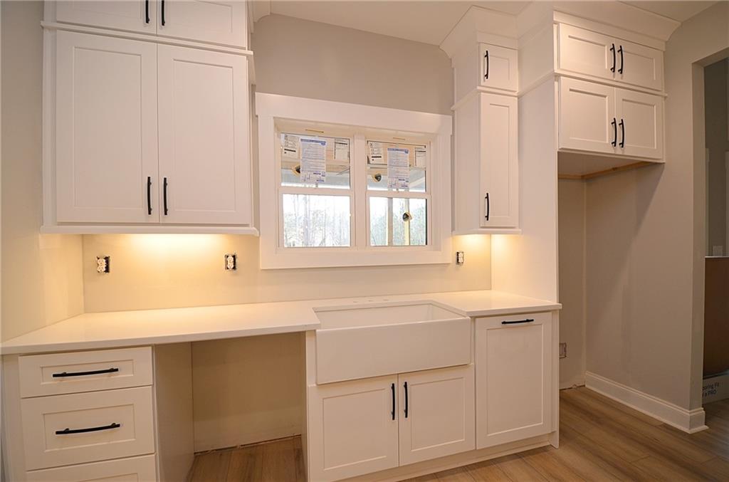 1216 Rays River Run Bogart, GA 30622 - Photo 8 of 25 a kitchen with white cabinets and sink