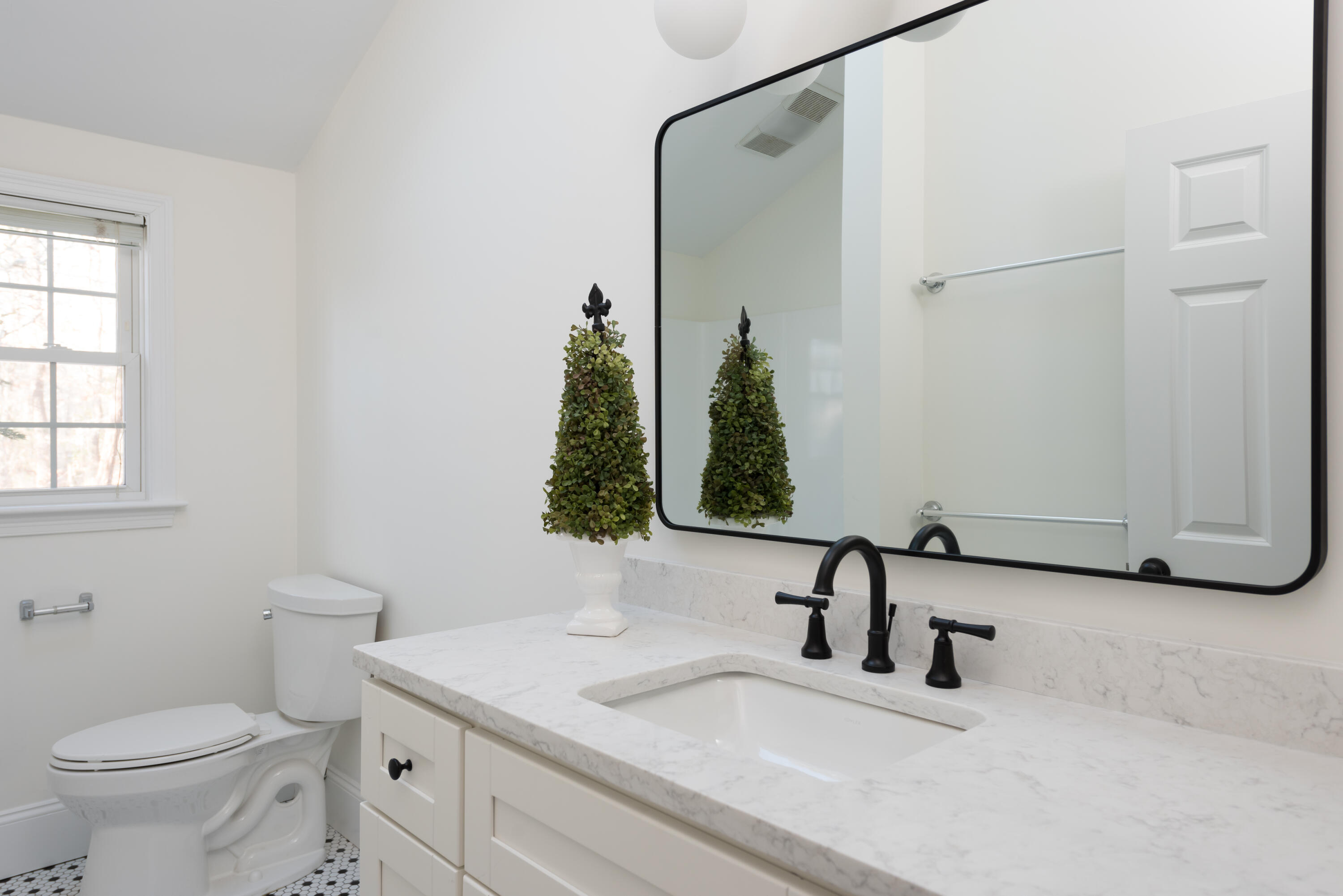 3 Neshobe Road Mashpee, MA 02649 - Photo 25 of 36 a bathroom with a sink and a mirror