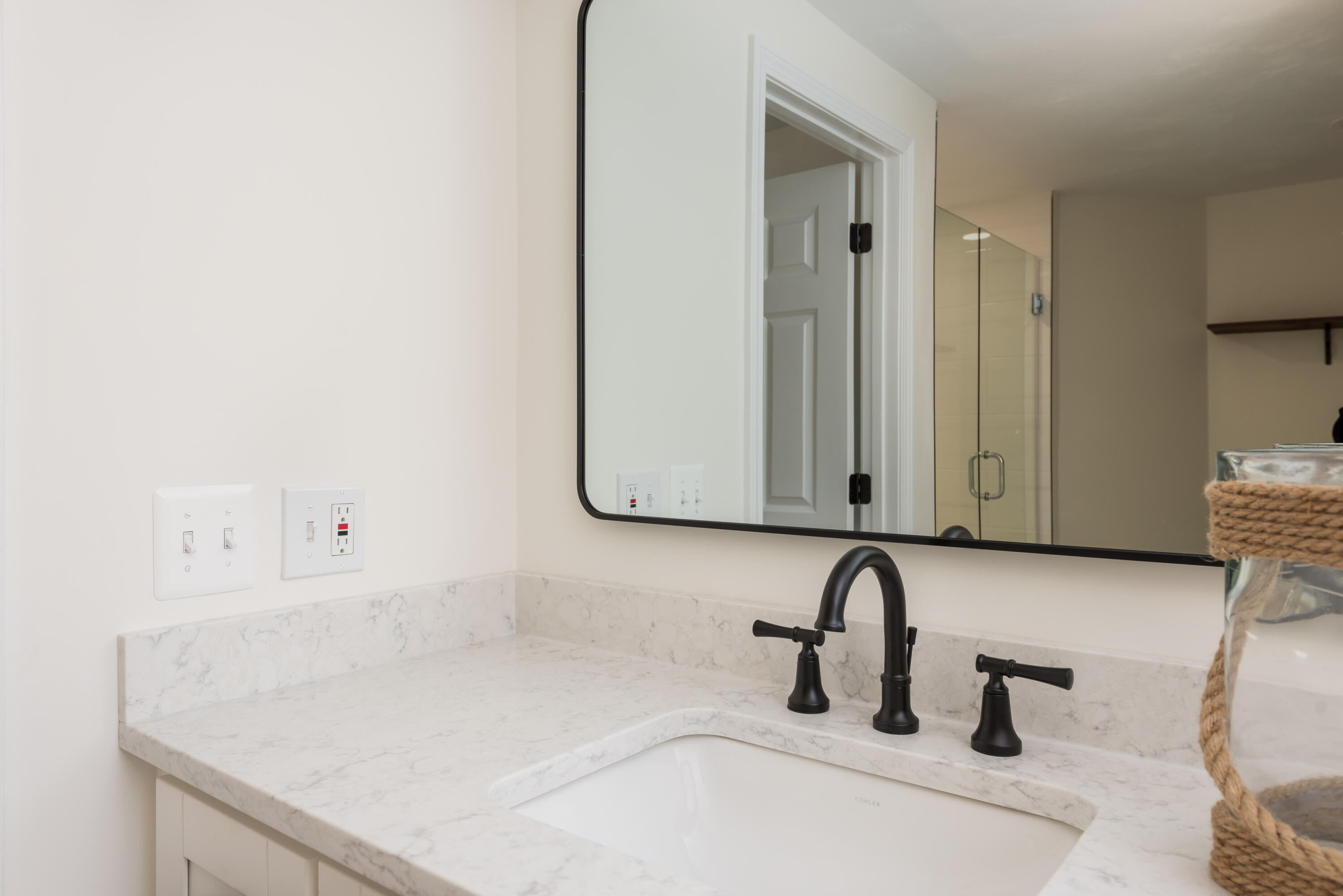 3 Neshobe Road Mashpee, MA 02649 - Photo 31 of 36 a bathroom with a sink and a mirror