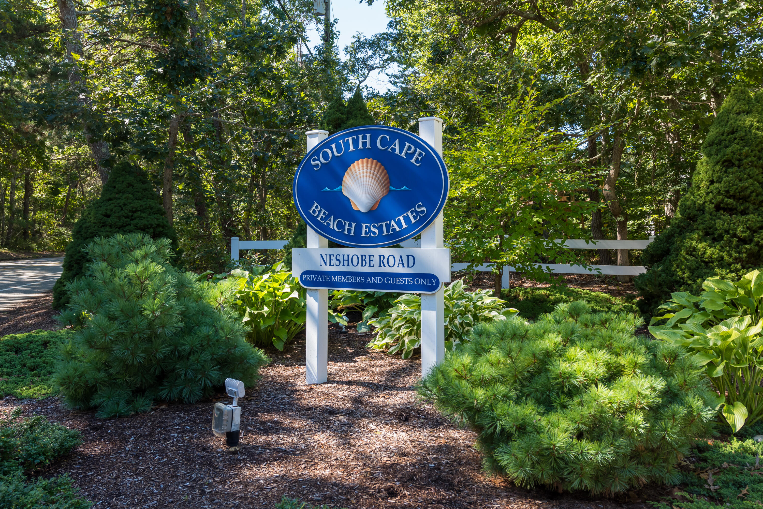 3 Neshobe Road Mashpee, MA 02649 - Photo 4 of 36 a sign that is sitting on a brick wall