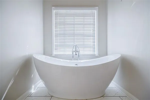 a white bath tub sitting in a bathroom