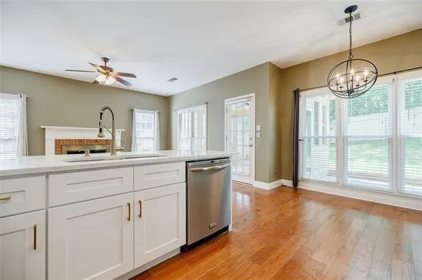 a open kitchen with stainless steel appliances granite countertop a stove and refrigerator