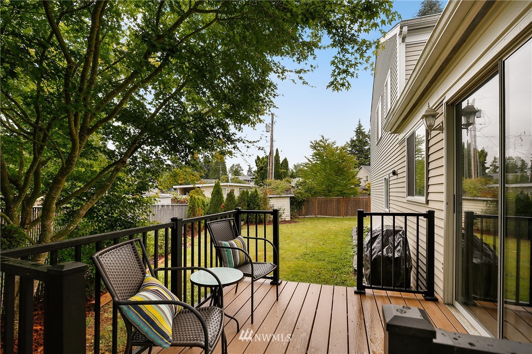 3602 Northeast 11th Court Renton, WA 98056 - Photo 20 of 25 a view of a balcony with chairs and wooden floor