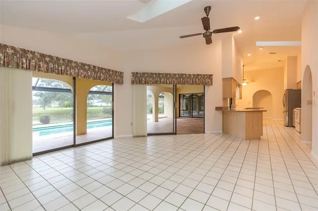 an aerial view of a house with outdoor space swimming pool