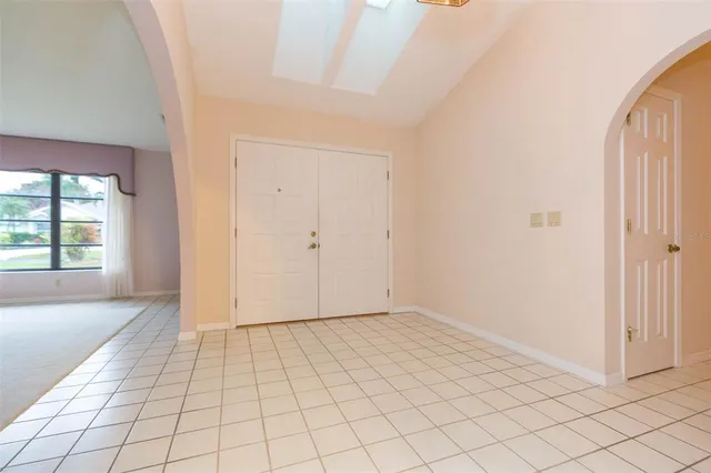 a kitchen with a refrigerator and a sink