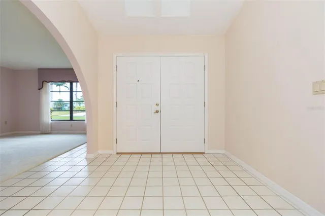 a kitchen with a sink dishwasher and a stove with wooden cabinets