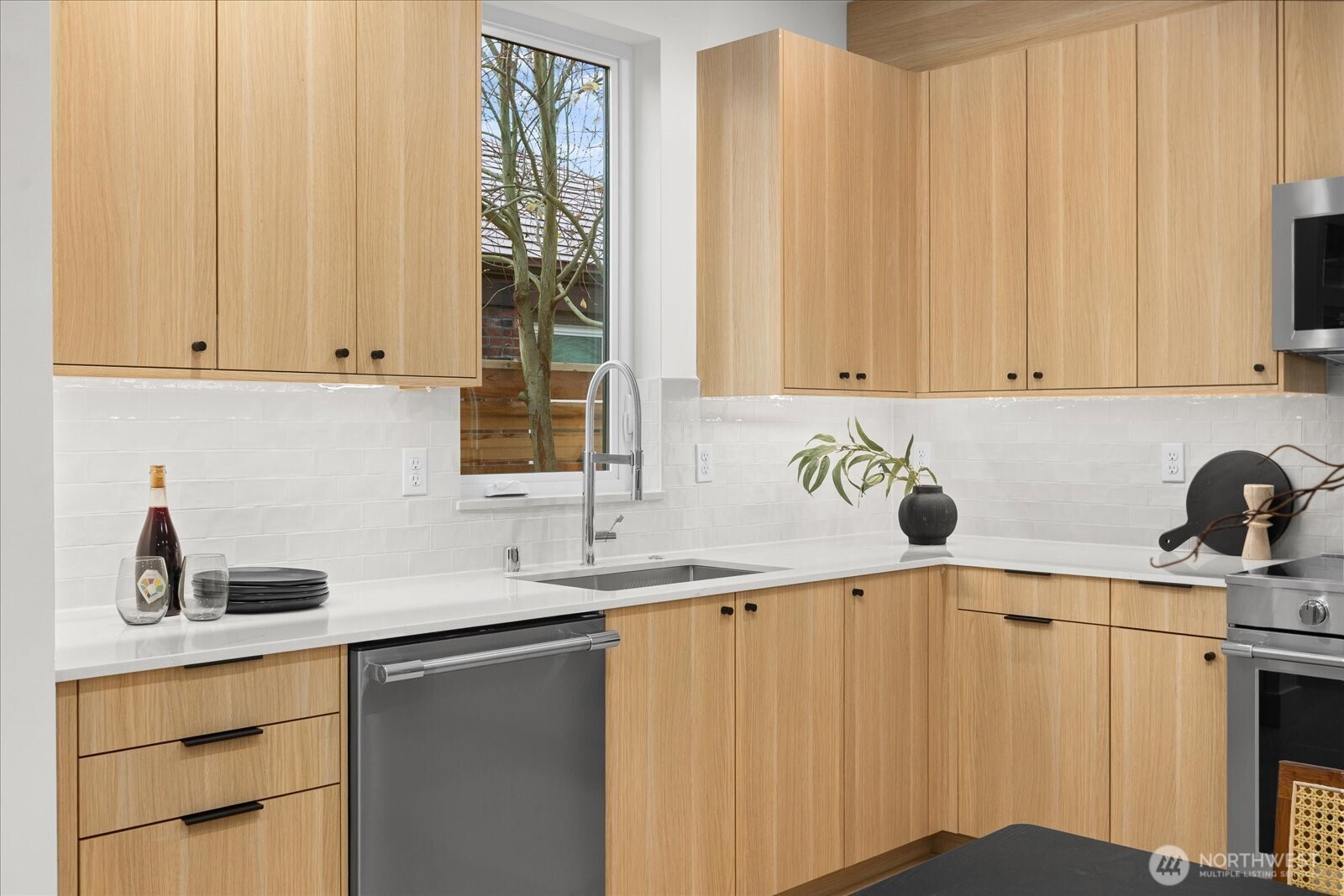 3407 Northwest 57th Street Seattle, WA 98107 - Photo 12 of 29 a kitchen with a sink cabinets and window