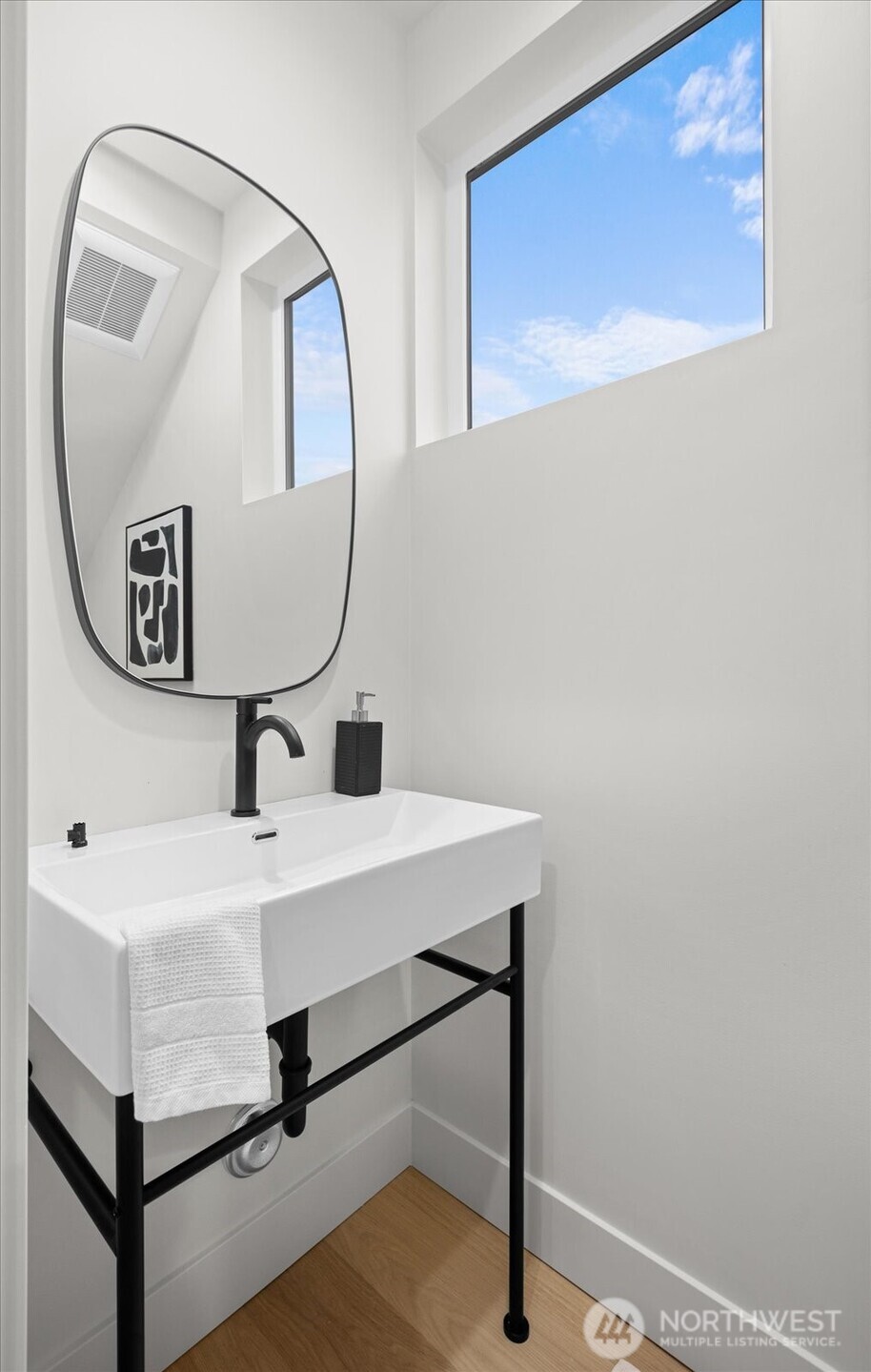3407 Northwest 57th Street Seattle, WA 98107 - Photo 13 of 29 a bathroom with a sink and a mirror