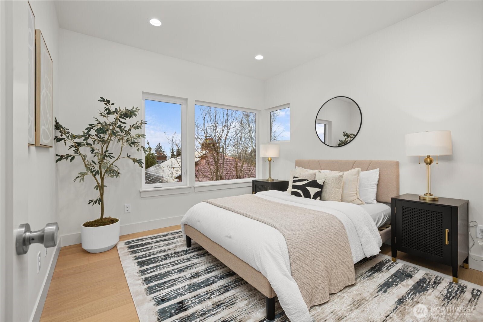 3407 Northwest 57th Street Seattle, WA 98107 - Photo 14 of 29 a bedroom with bed and a potted plant