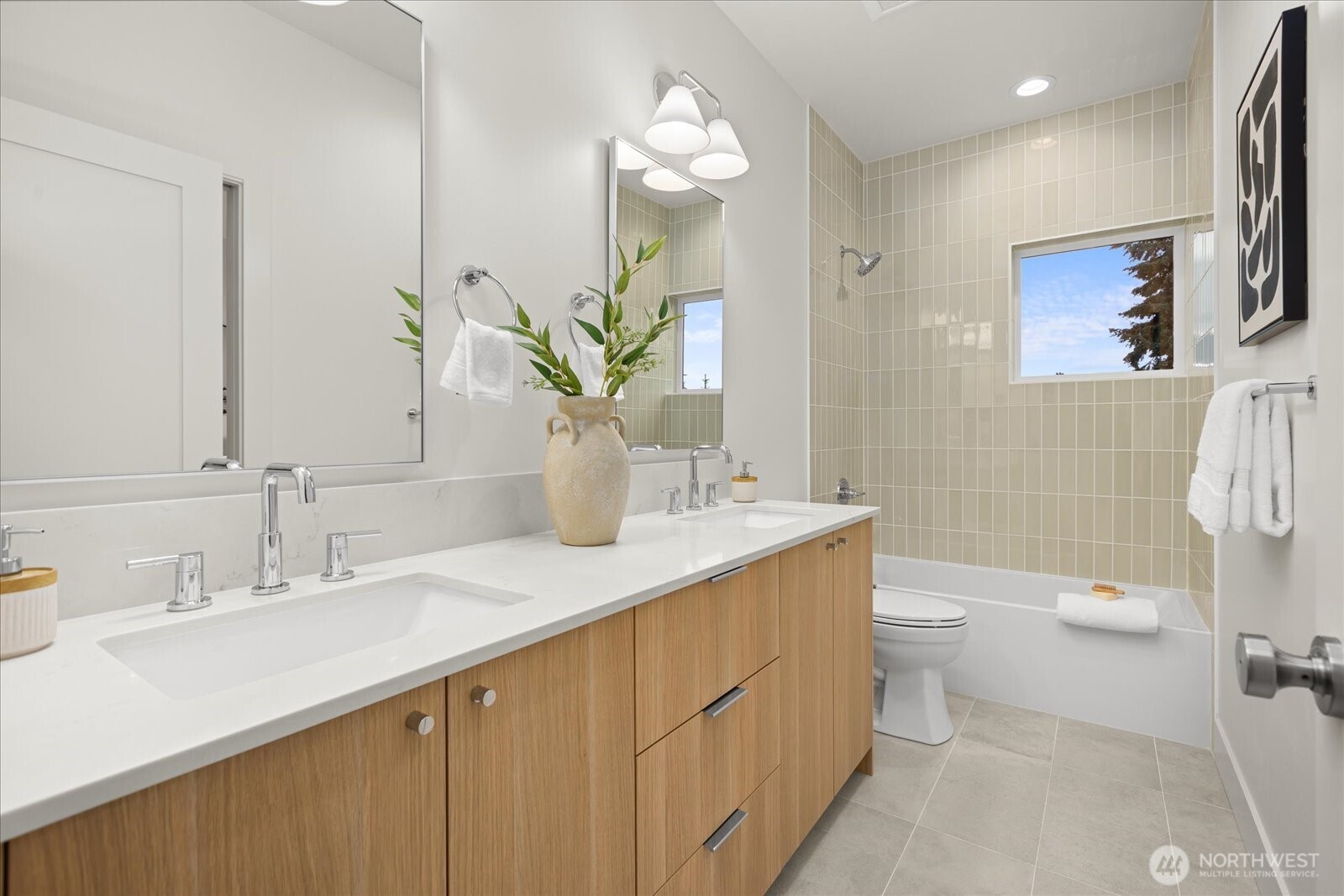 3407 Northwest 57th Street Seattle, WA 98107 - Photo 20 of 29 a bathroom with a sink a toilet and mirror