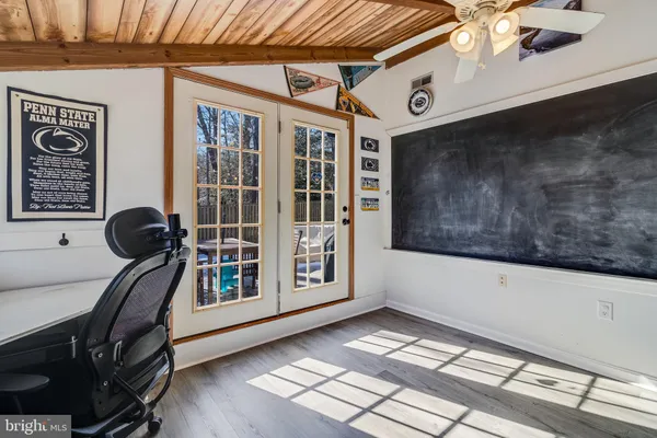 a view of an entryway with wooden floor