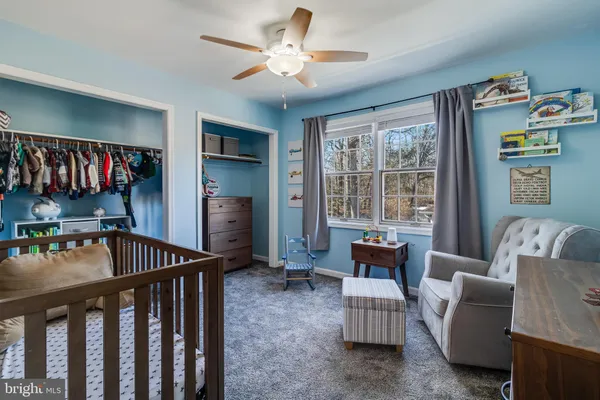a bedroom with furniture and a window