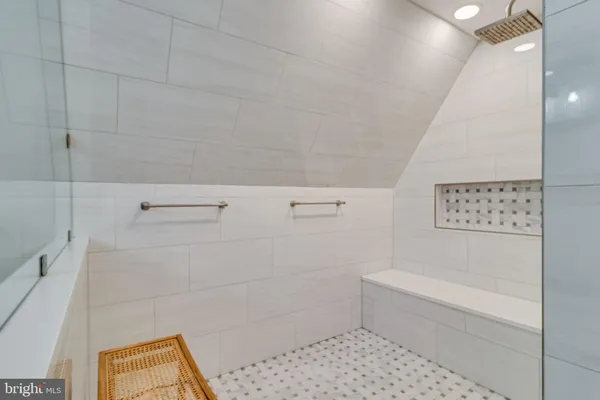 a bathroom with a bathtub and shower