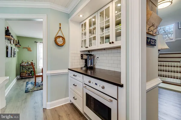 a kitchen with a refrigerator and a stove