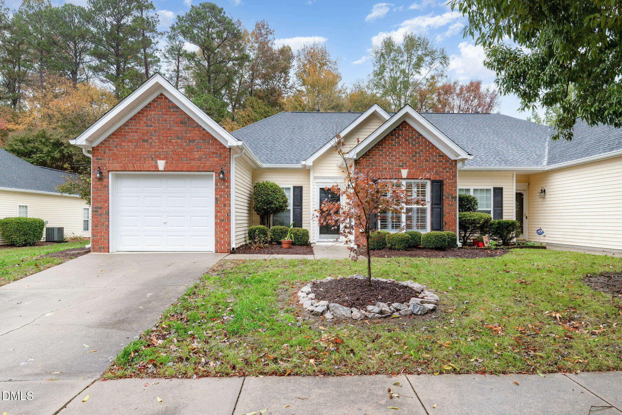 2541 Forest Shadows Lane Raleigh, NC 27614 - Photo 1 of 23 a front view of a house with a yard and garage