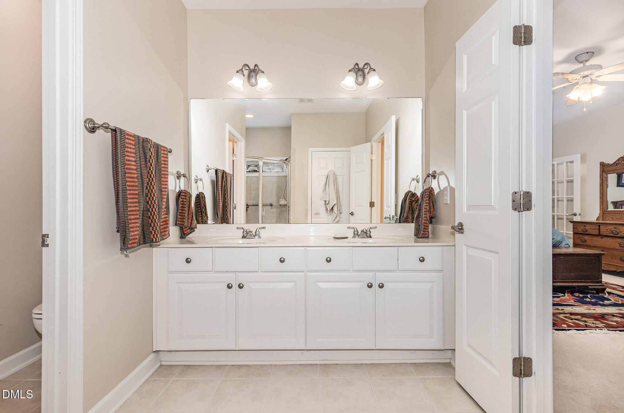 2541 Forest Shadows Lane Raleigh, NC 27614 - Photo 16 of 23 a bathroom with a sink vanity and a mirror
